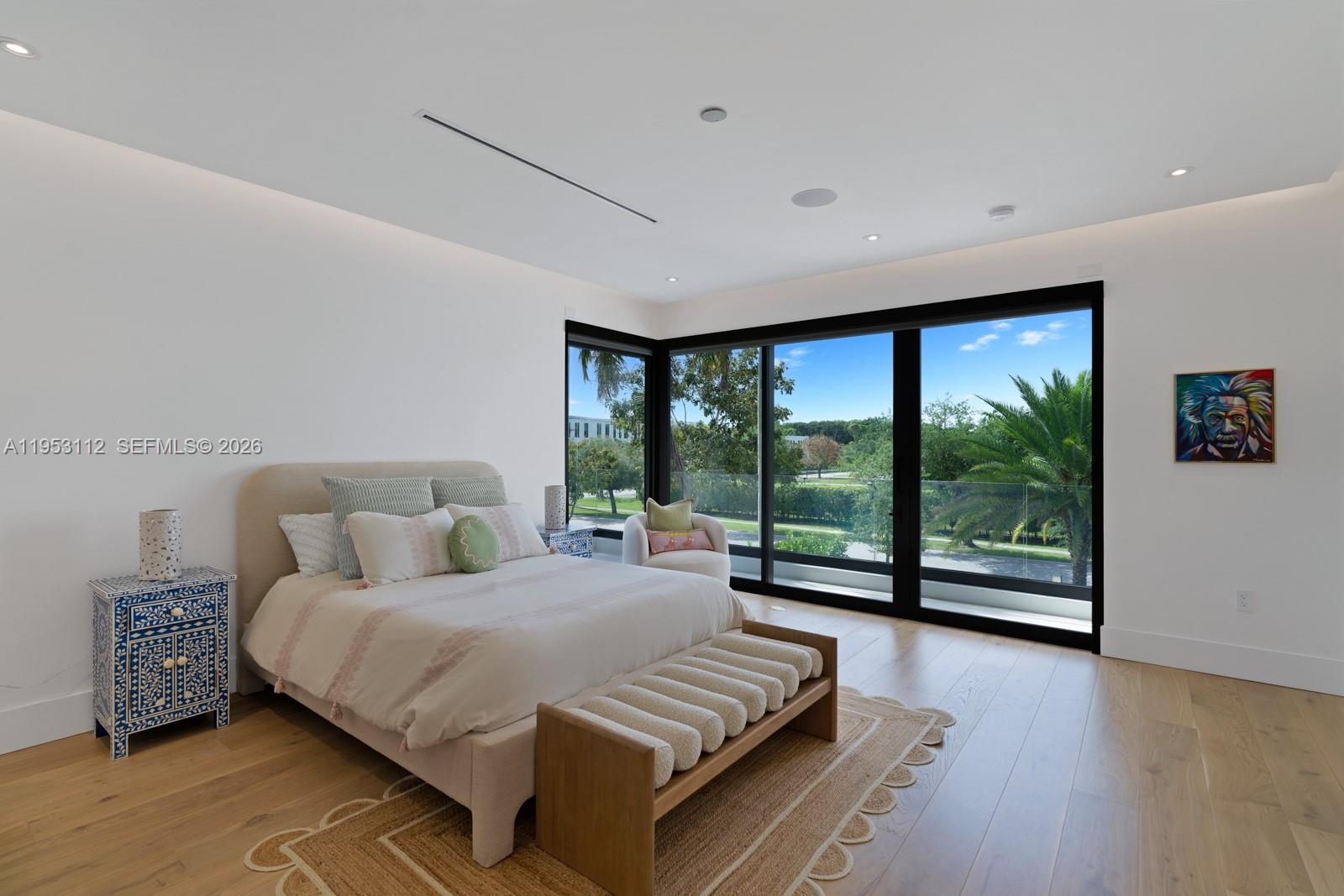 6031 Southwest 88th Street Miami, FL 33156 - Photo 35 of 81 a bedroom with a large bed and a large window