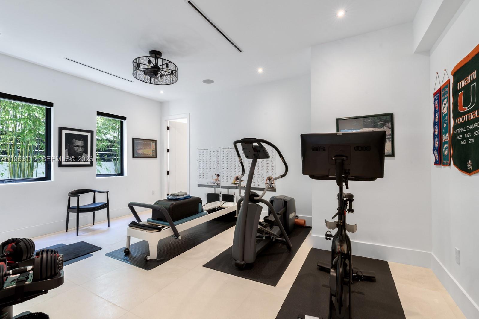 6031 Southwest 88th Street Miami, FL 33156 - Photo 40 of 81 a living room with furniture a flat screen tv and a window