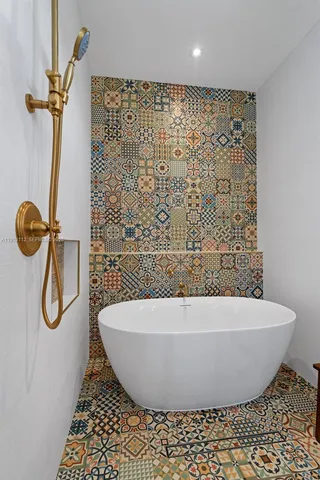 an aerial view of residential houses with outdoor space and river