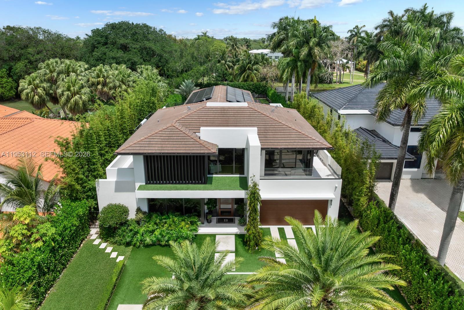 6031 Southwest 88th Street Miami, FL 33156 - Photo 55 of 81 a front view of a house with a yard