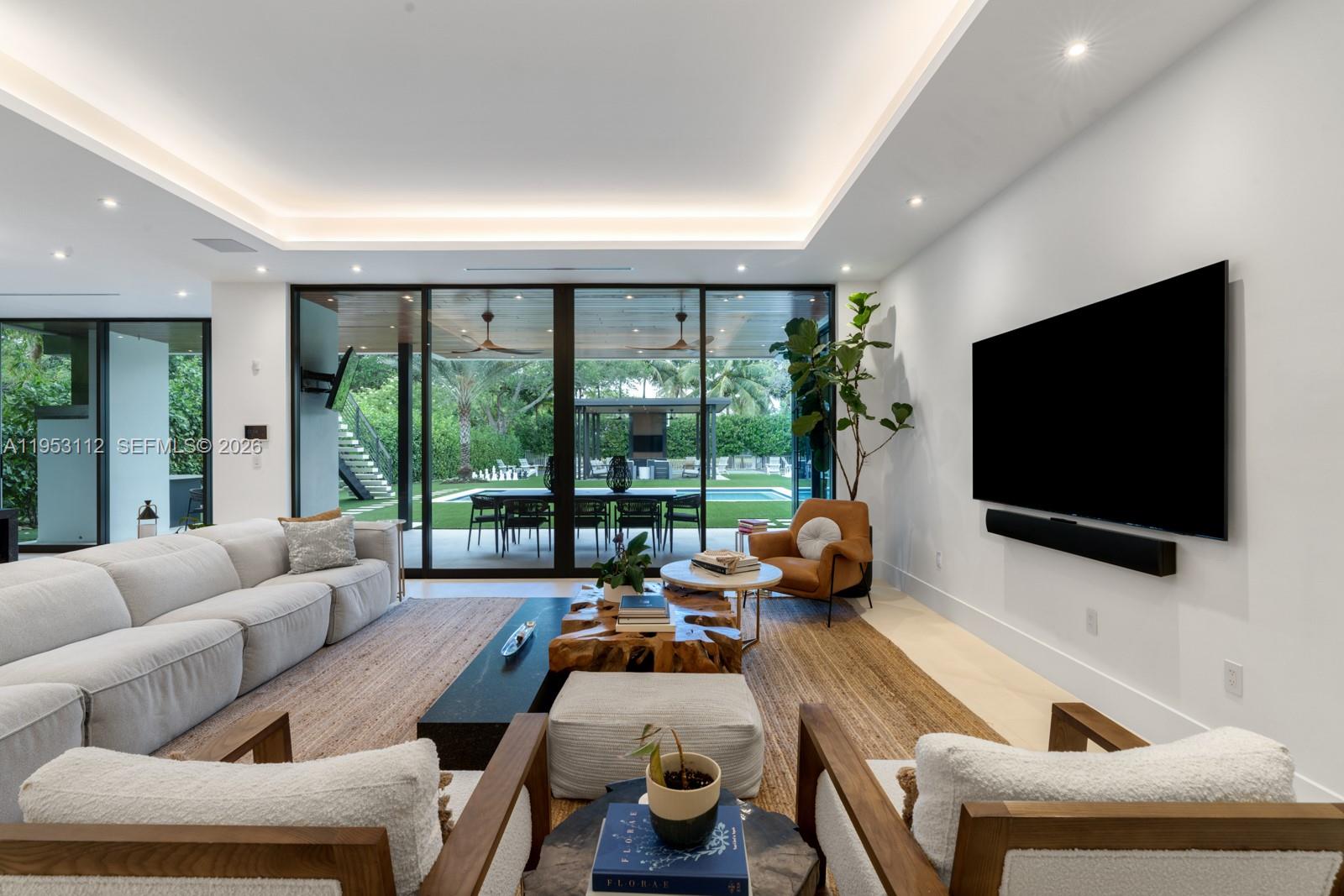 6031 Southwest 88th Street Miami, FL 33156 - Photo 6 of 81 a room with furniture and a flat screen tv