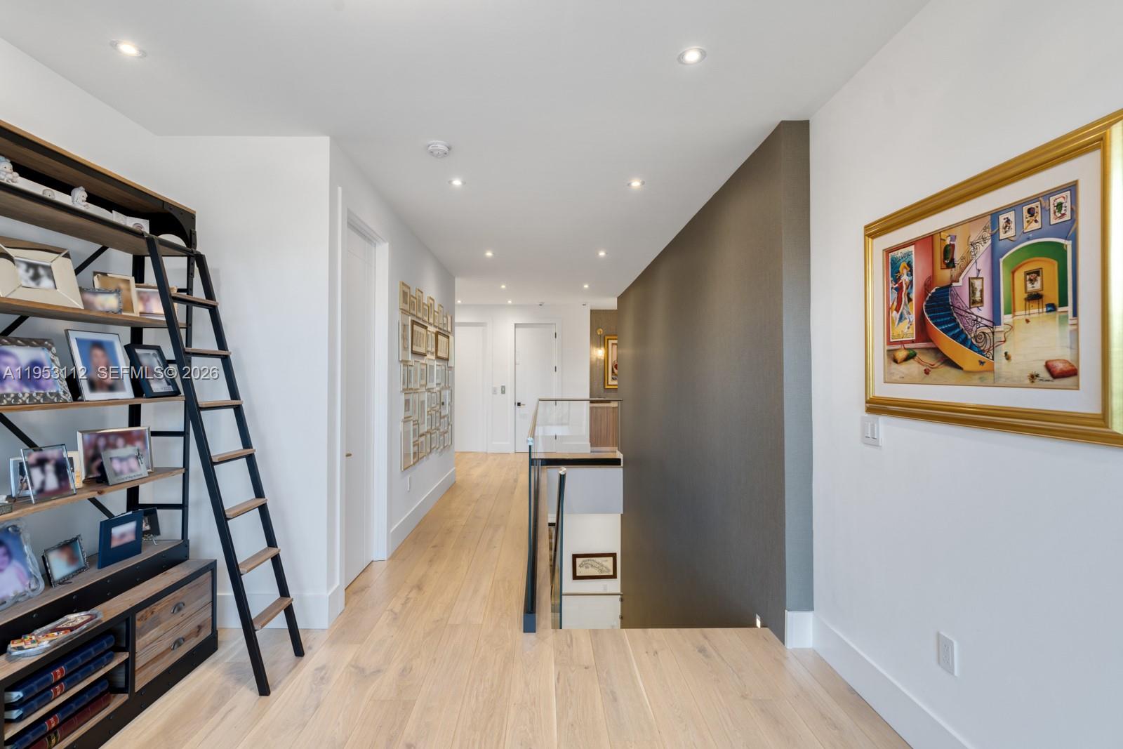 6031 Southwest 88th Street Miami, FL 33156 - Photo 64 of 81 a view of a hallway with wooden floor and stairs