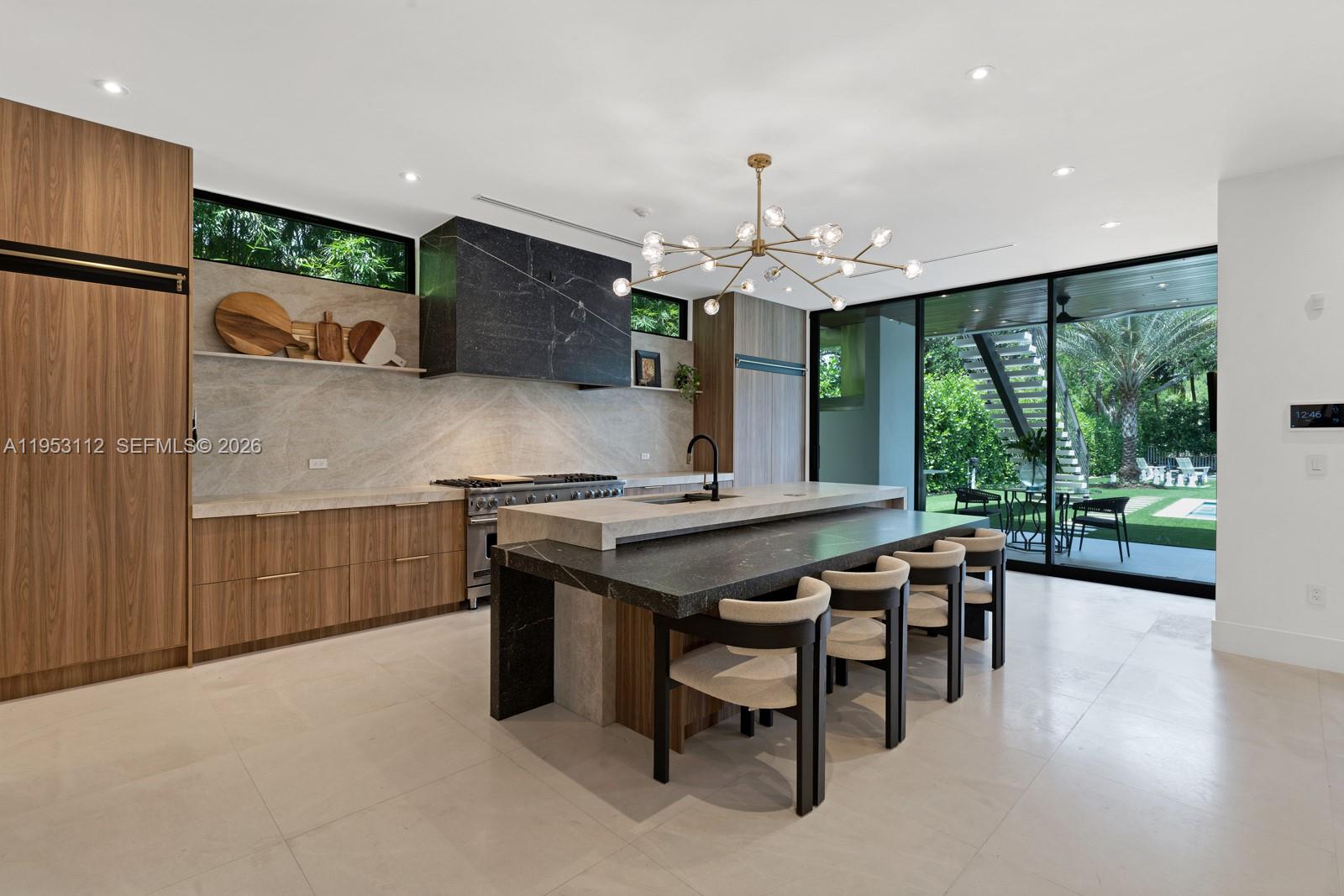 6031 Southwest 88th Street Miami, FL 33156 - Photo 10 of 81 a kitchen with stainless steel appliances granite countertop a stove and a refrigerator