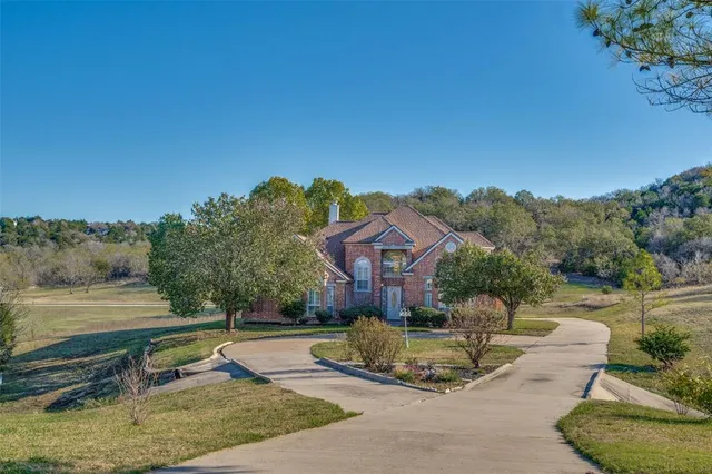a view of a house with pool porch and sitting area