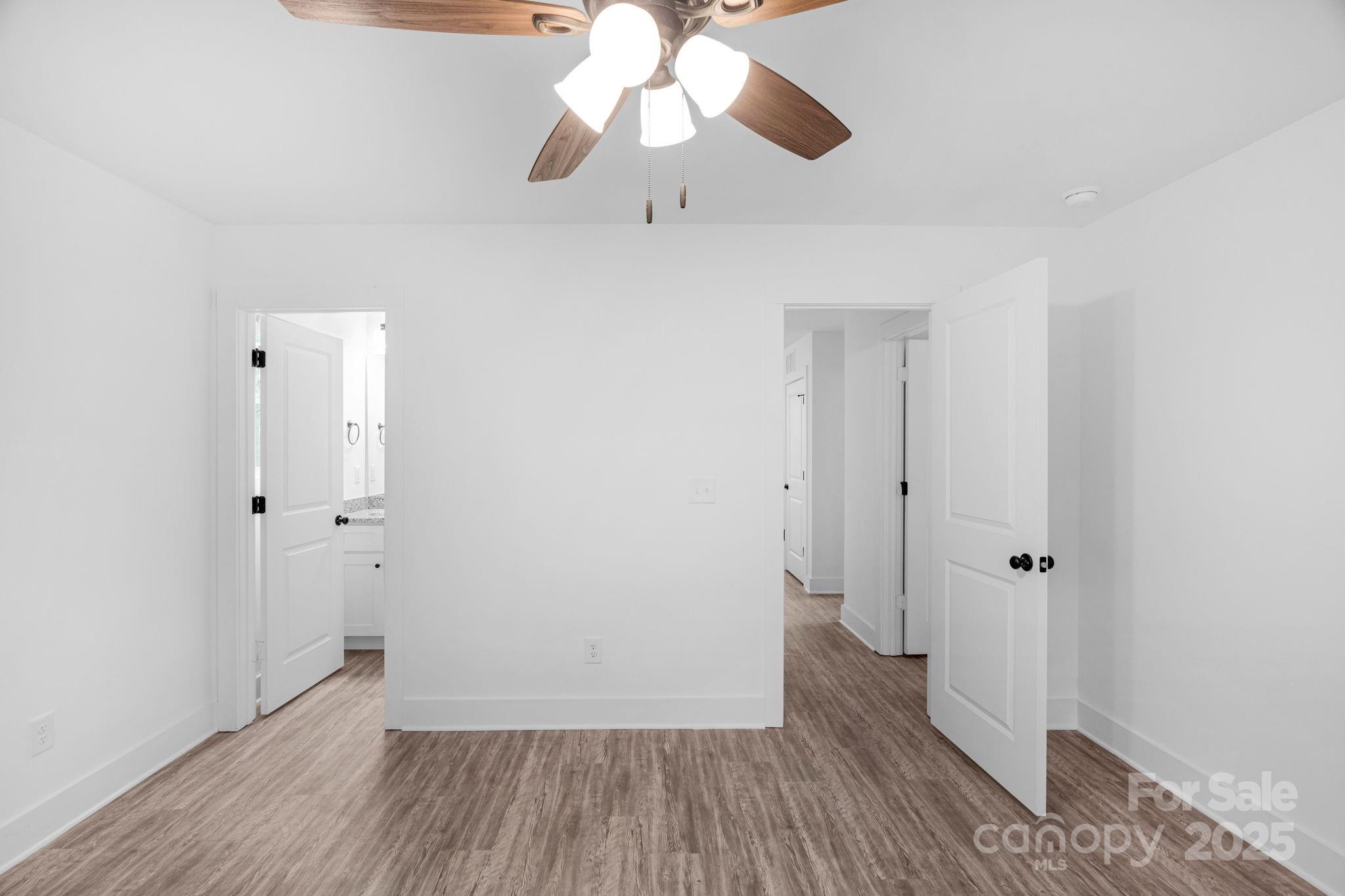 324 Ashford Street Chester, SC 29706 - Photo 13 of 20 wooden floor in an empty room with a window