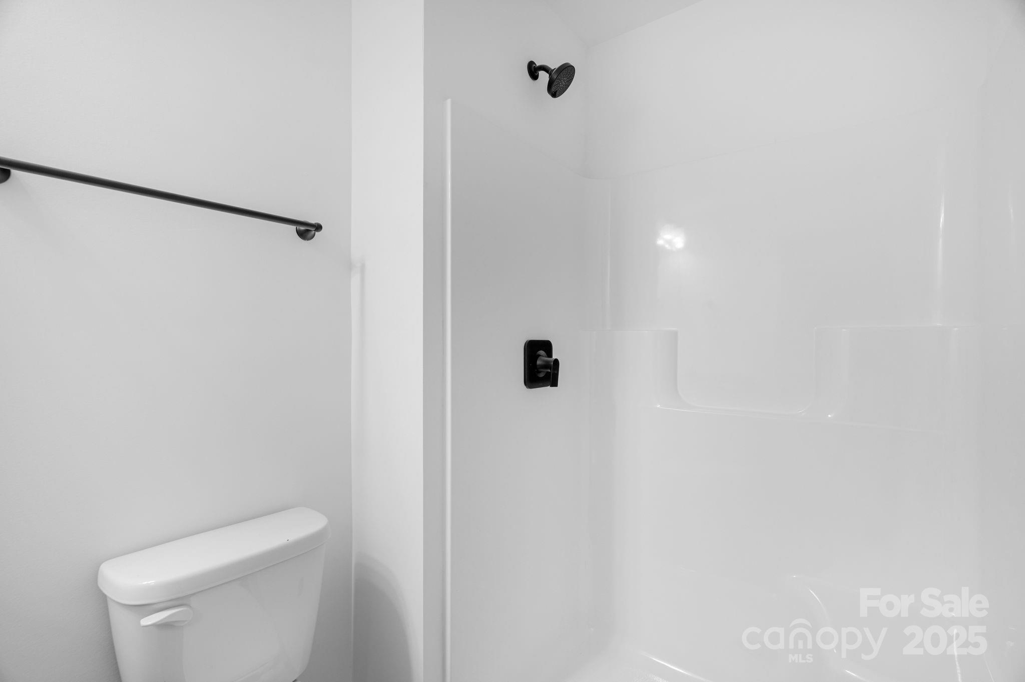 324 Ashford Street Chester, SC 29706 - Photo 15 of 20 a bathroom with a toilet and a shower