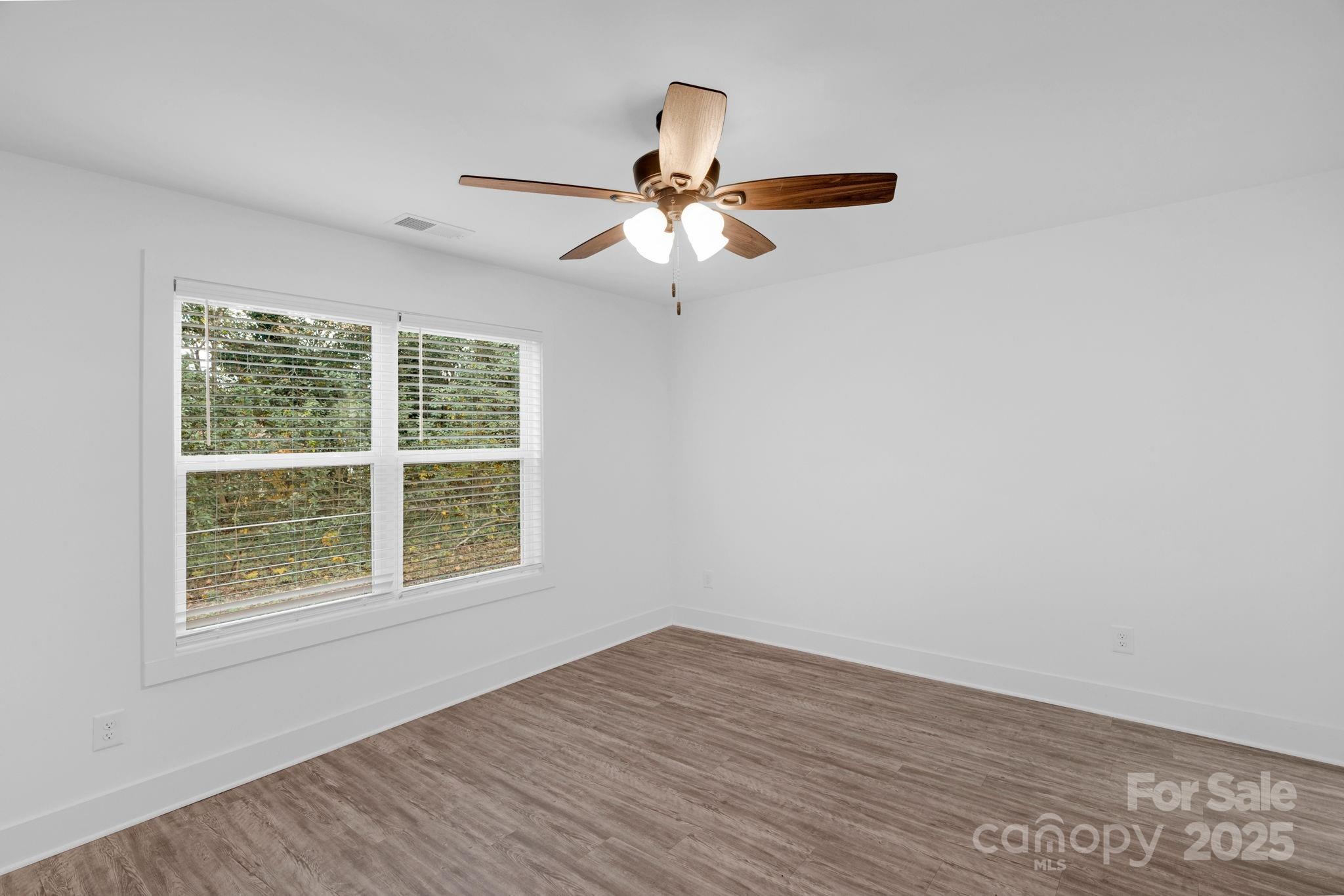 324 Ashford Street Chester, SC 29706 - Photo 16 of 20 an empty room with a window and a fan