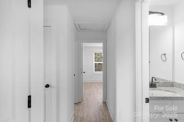 a view of a bathroom from a hallway