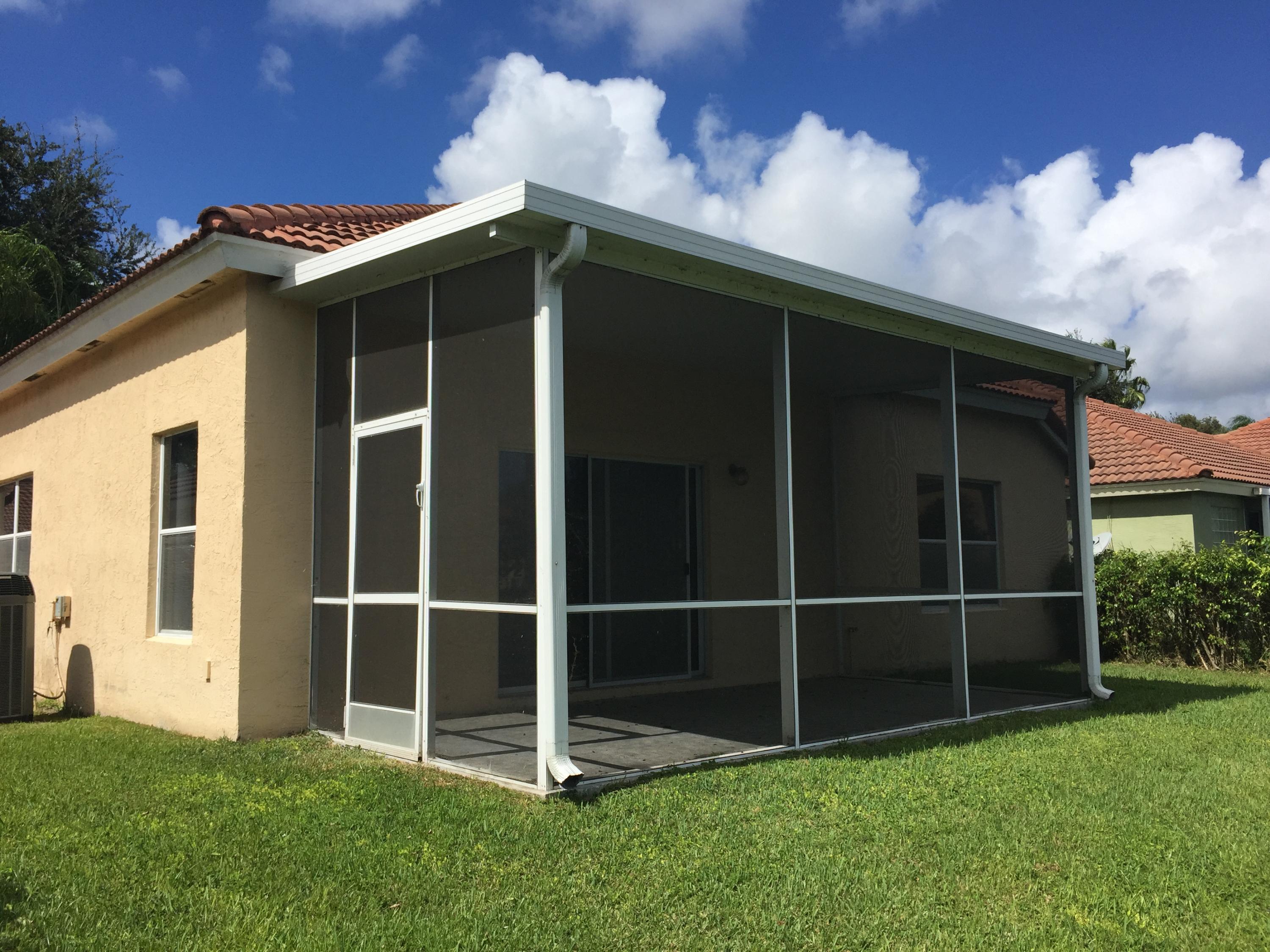 1015 Aspri Way Riviera Beach, FL 33418 - Photo 10 of 11 Rear Screened Patio