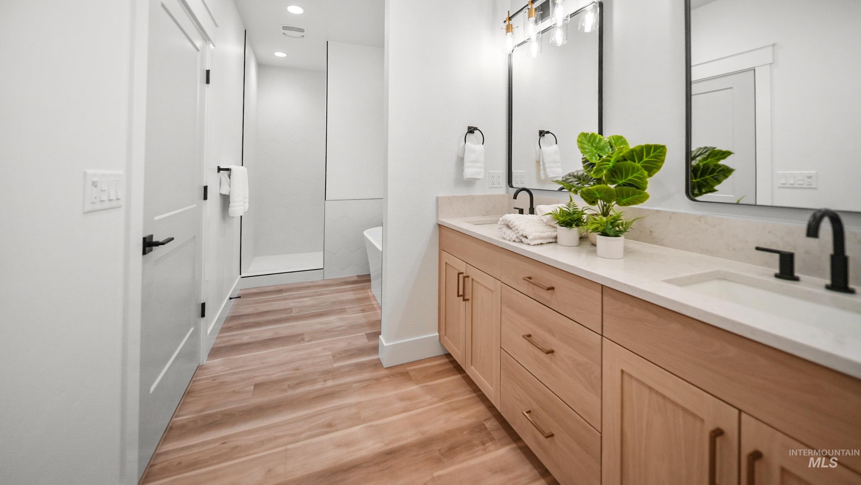 696 Full Moon Way Twin Falls, ID 83301 - Photo 25 of 48 Bathroom featuring double vanity, light wood-style floors, a freestanding bath, and recessed lighting
