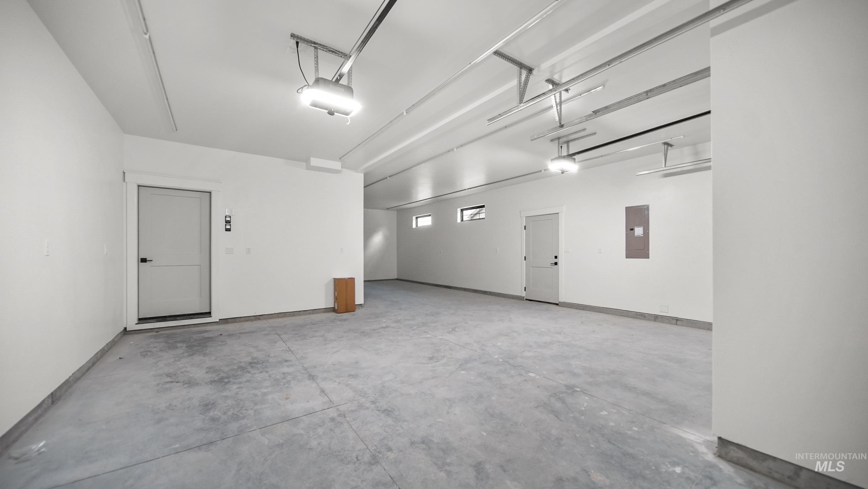 696 Full Moon Way Twin Falls, ID 83301 - Photo 34 of 48 Garage featuring electric panel and a garage door opener