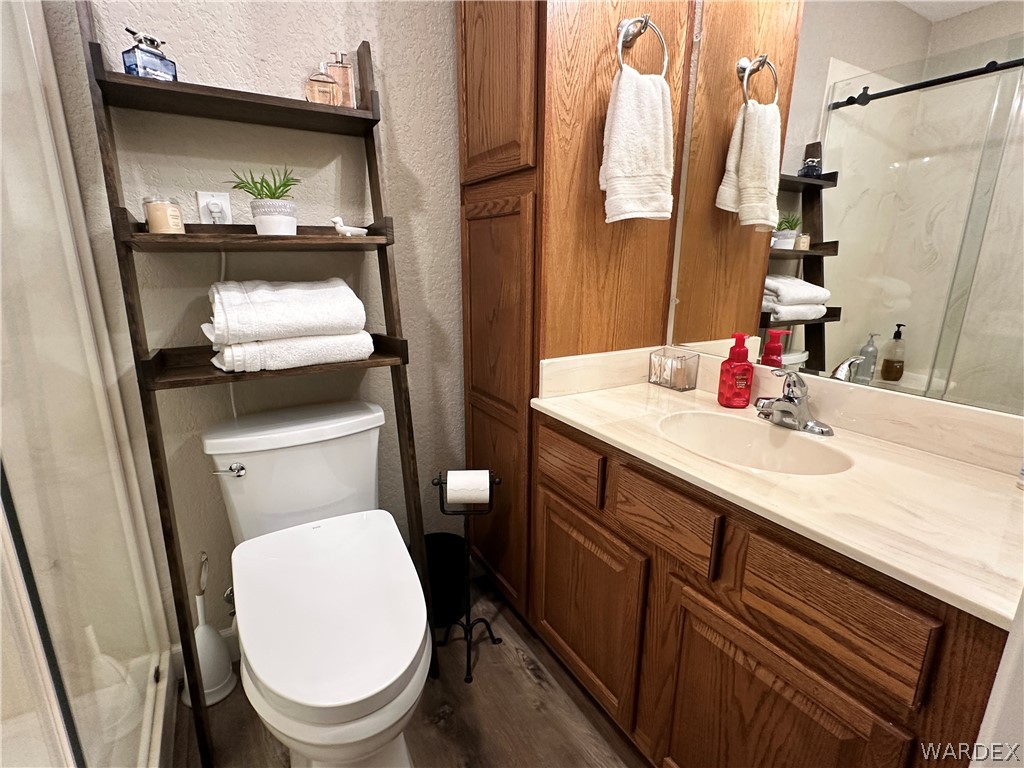 6615 Flag Mine Road Kingman, AZ 86401 - Photo 26 of 72 a bathroom with a sink a toilet and shower