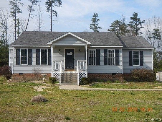 24480 Johnson Road Jetersville, VA 23083 - Photo 1 of 16 a front view of a house with a garden