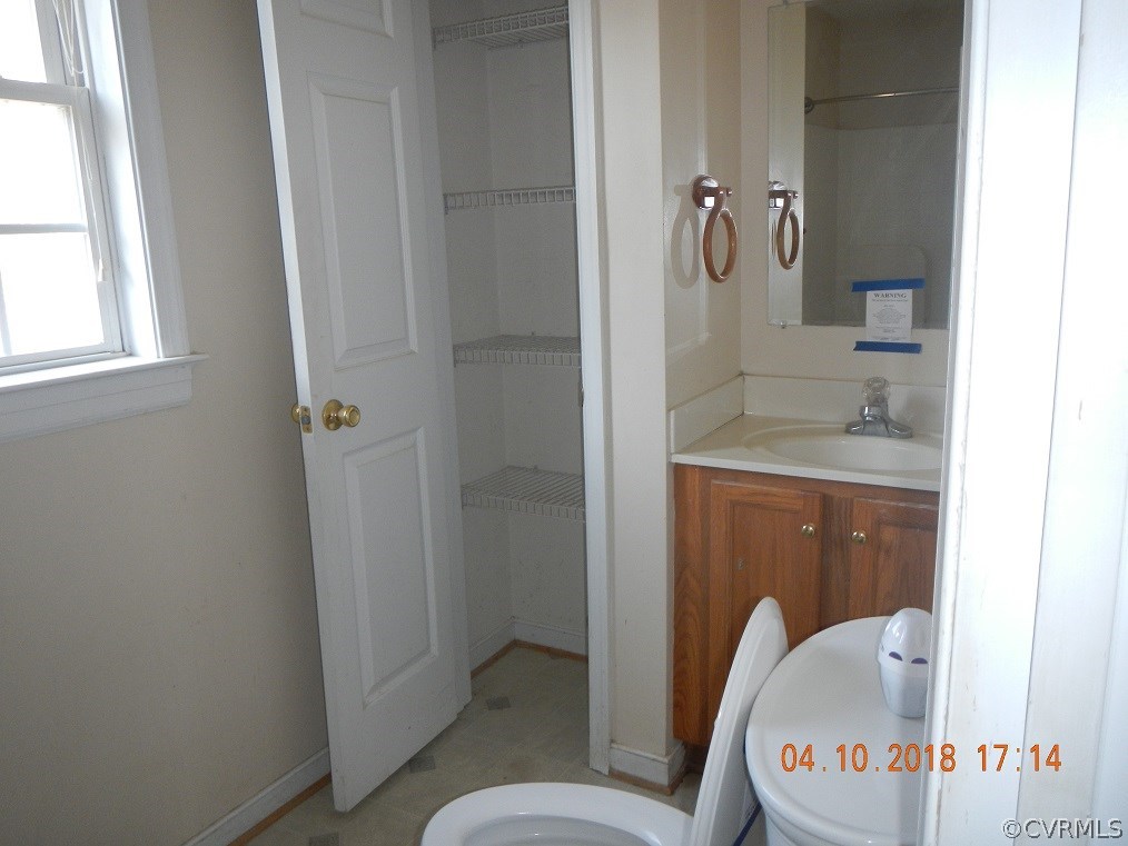 24480 Johnson Road Jetersville, VA 23083 - Photo 15 of 16 a bathroom with a granite countertop sink toilet and shower