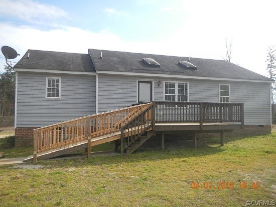 24480 Johnson Road Jetersville, VA 23083 - Photo 3 of 16 a view of a house with wooden deck and a yard