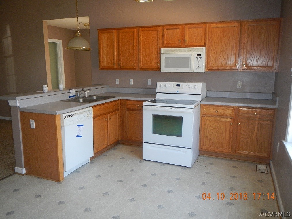 24480 Johnson Road Jetersville, VA 23083 - Photo 6 of 16 a kitchen with stainless steel appliances granite countertop a stove a sink and a microwave