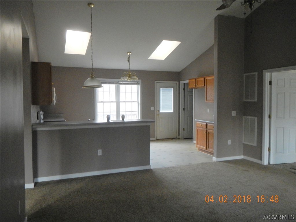 24480 Johnson Road Jetersville, VA 23083 - Photo 7 of 16 an empty room with windows cabinet and front door