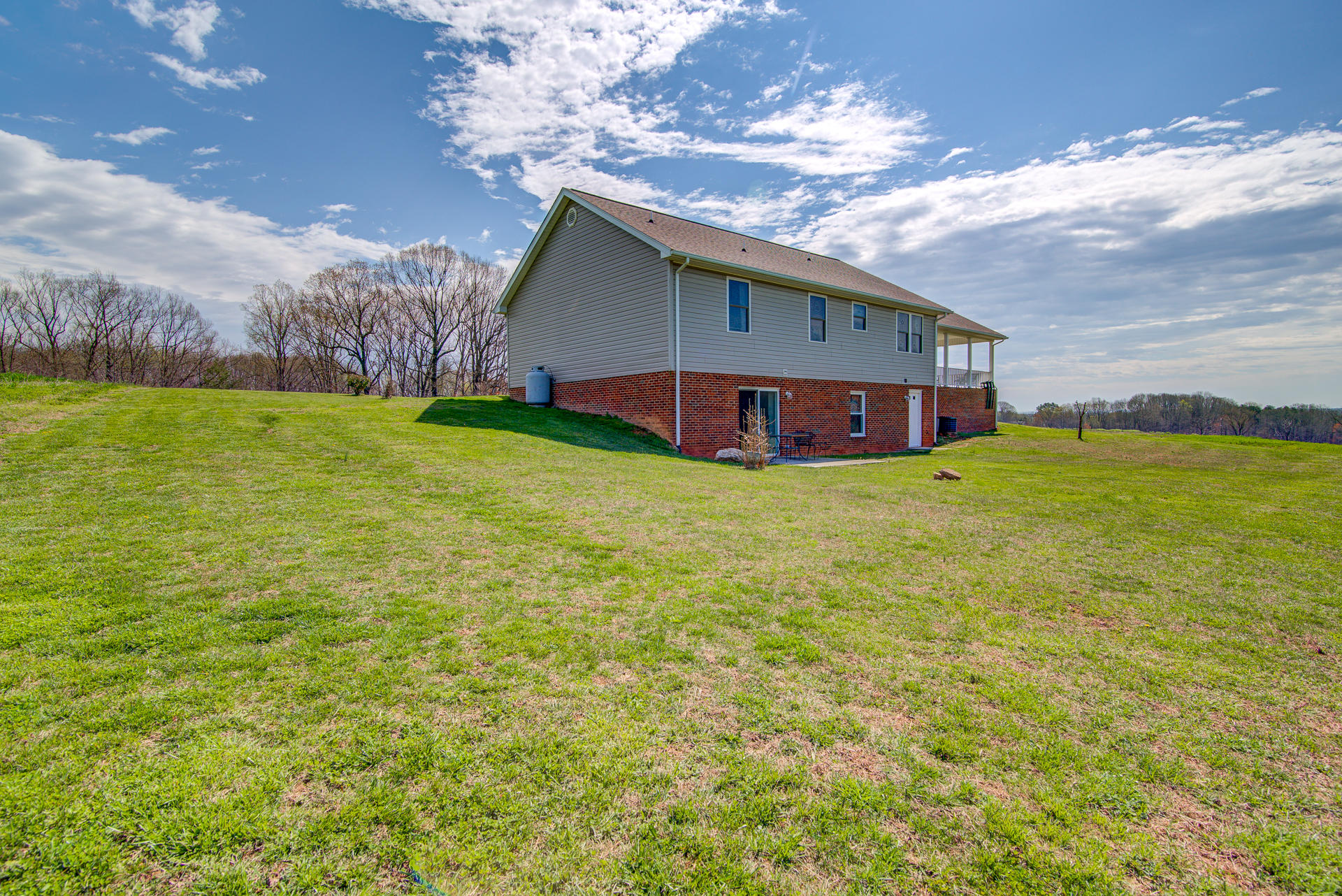 3007 Sandy Level Road Goodview, VA 24095 - Photo 13 of 51 a view of a house with a yard and sitting area