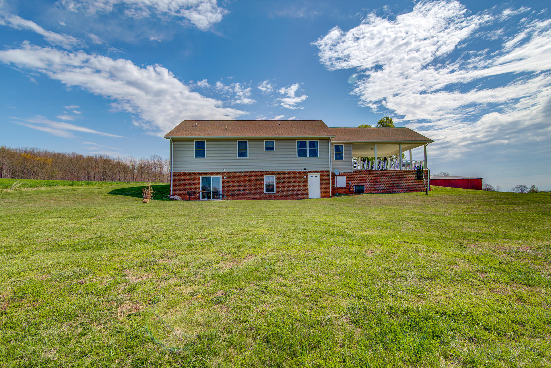 3007 Sandy Level Road Goodview, VA 24095 - Photo 14 of 51 a view of a house with a big yard and large tree