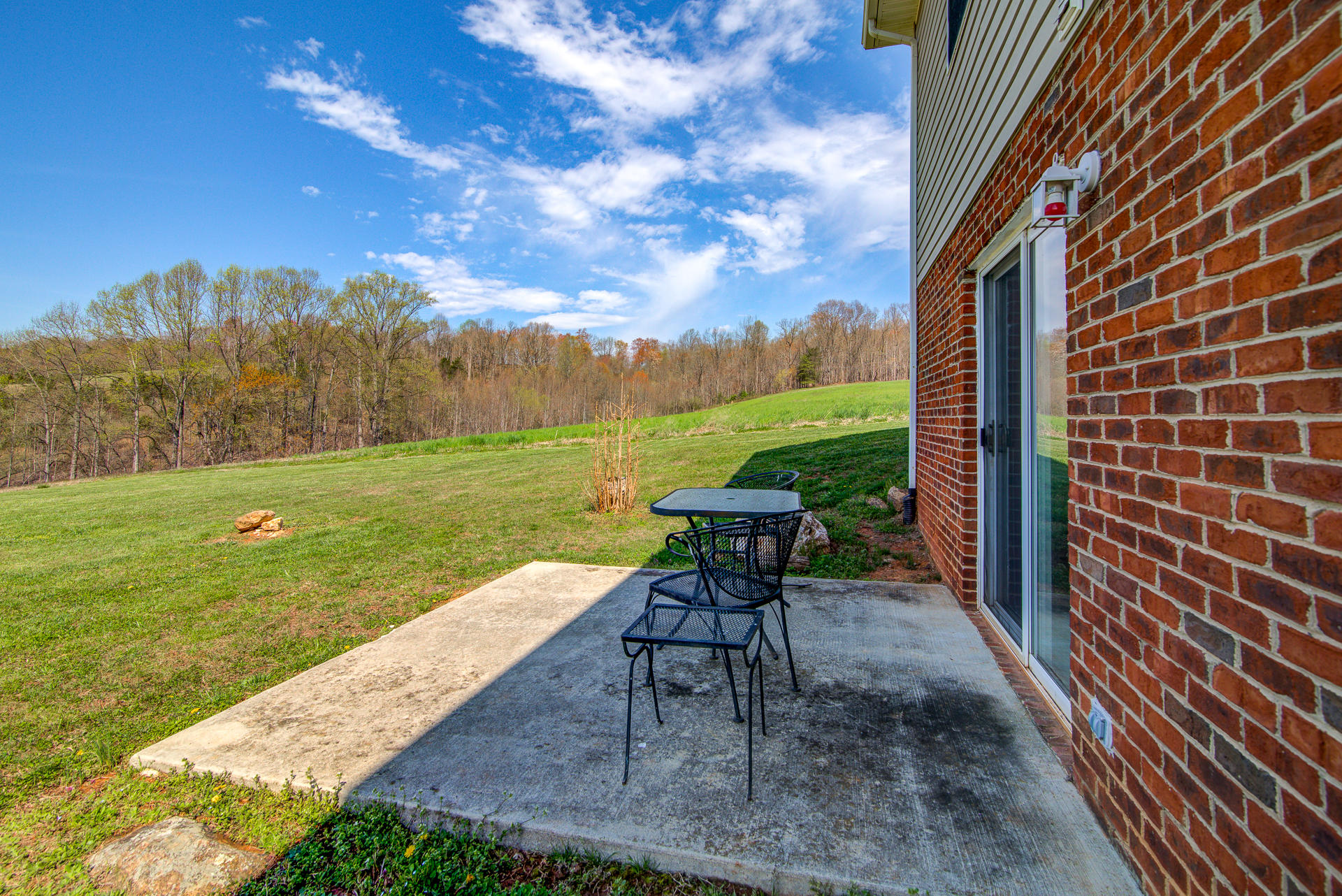 3007 Sandy Level Road Goodview, VA 24095 - Photo 15 of 51 a view of a table and chairs in patio with a yard