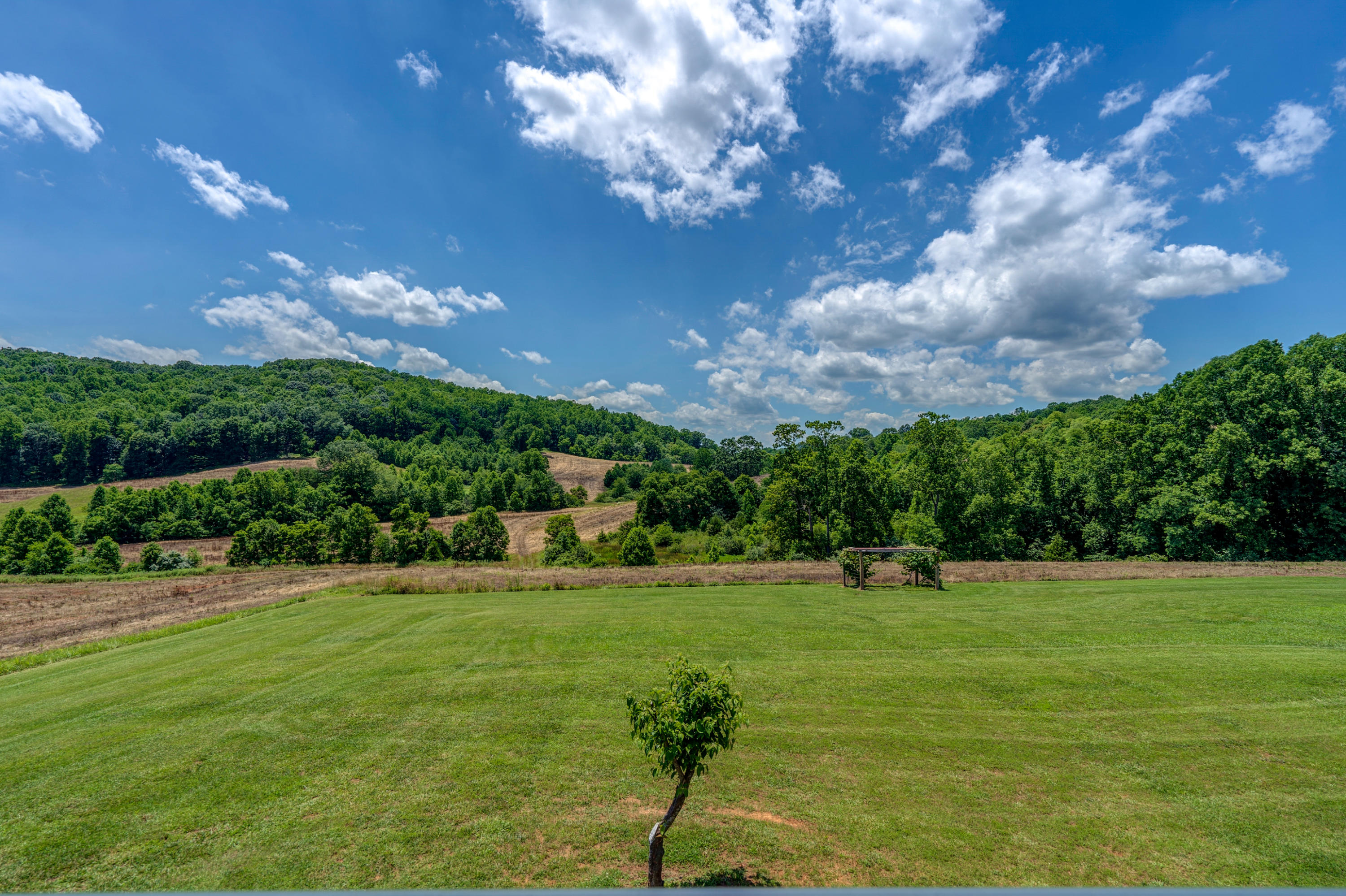 3007 Sandy Level Road Goodview, VA 24095 - Photo 4 of 51 a view of a golf course with a garden