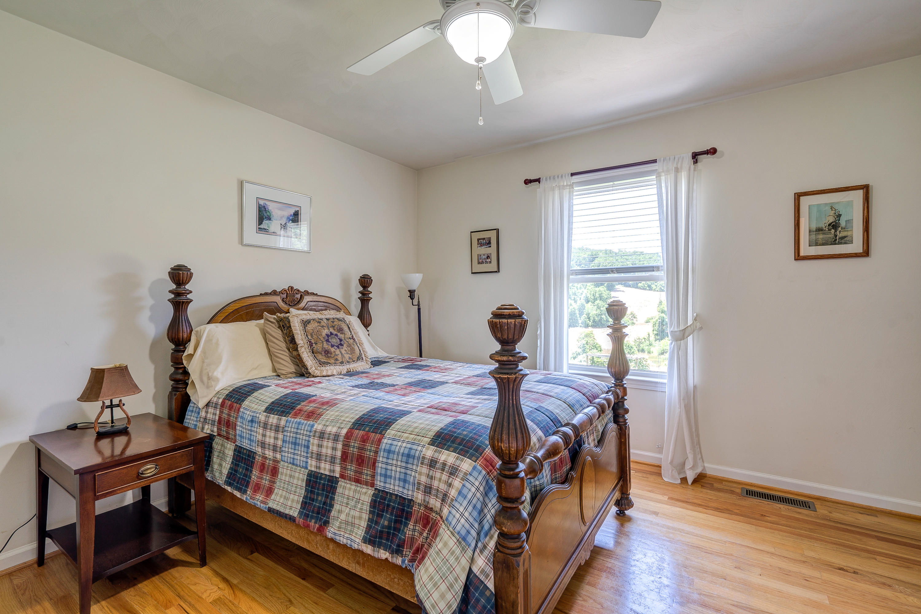 3007 Sandy Level Road Goodview, VA 24095 - Photo 43 of 51 a bedroom with a bed and a chandelier