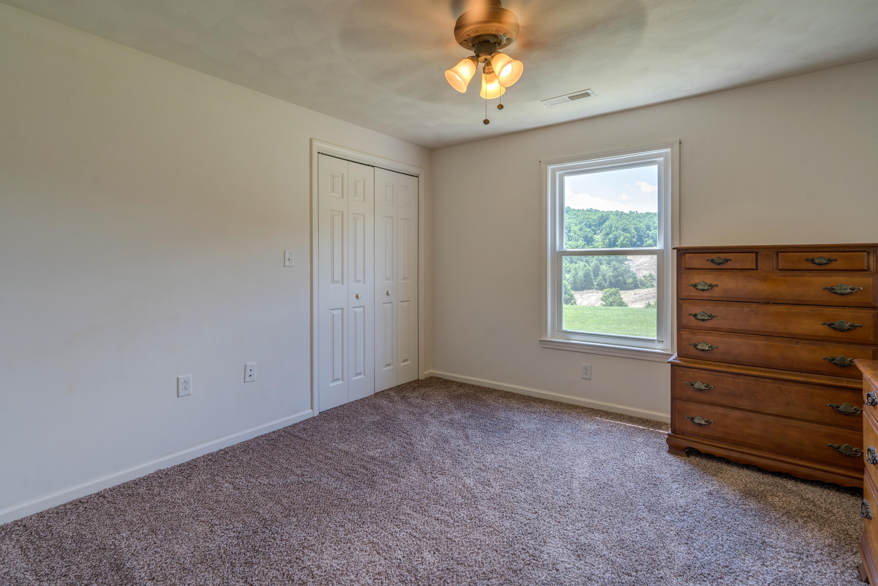 3007 Sandy Level Road Goodview, VA 24095 - Photo 48 of 51 wooden floor in an empty room with a window