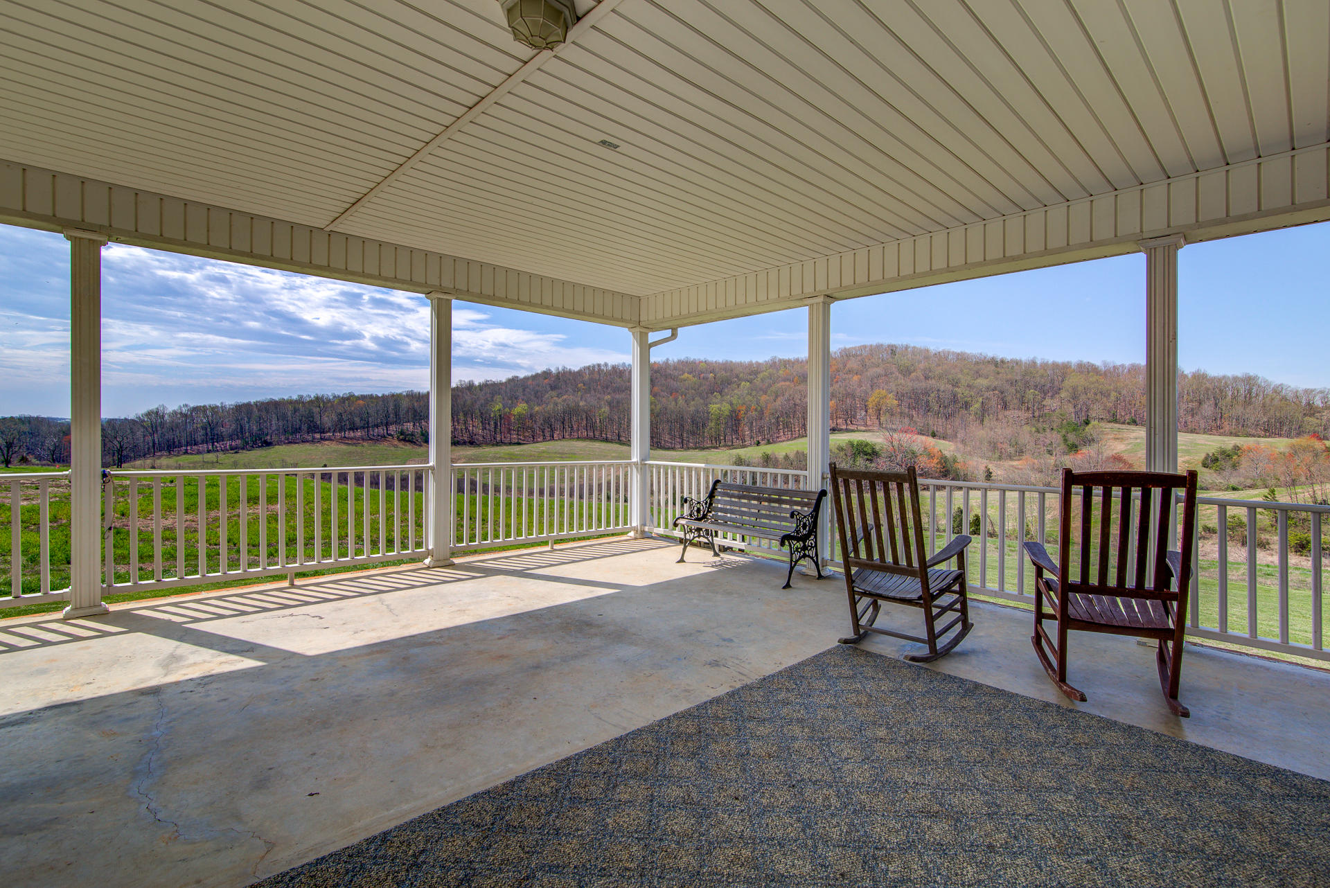 3007 Sandy Level Road Goodview, VA 24095 - Photo 7 of 51 a view of a deck with a table and chairs next to a yard
