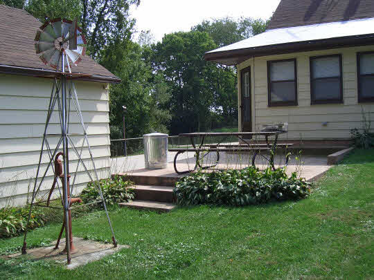 4505 Simpson Road Rockford, IL 61102 - Photo 9 of 10 a front view of a house with garden