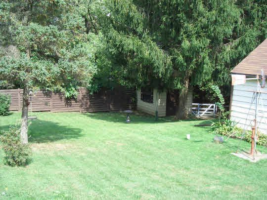 4505 Simpson Road Rockford, IL 61102 - Photo 10 of 10 a backyard of a house with lots of green space