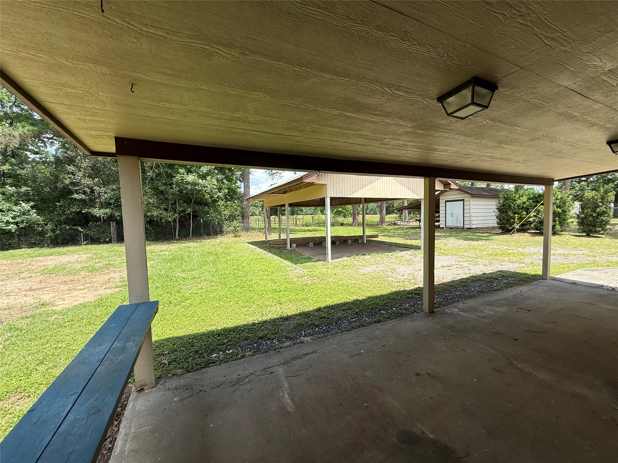 18751 FM 1484 Road Conroe, TX 77303 - Photo 33 of 36 Covered back patio. Detached car port. Storage shed is excluded from property rental.