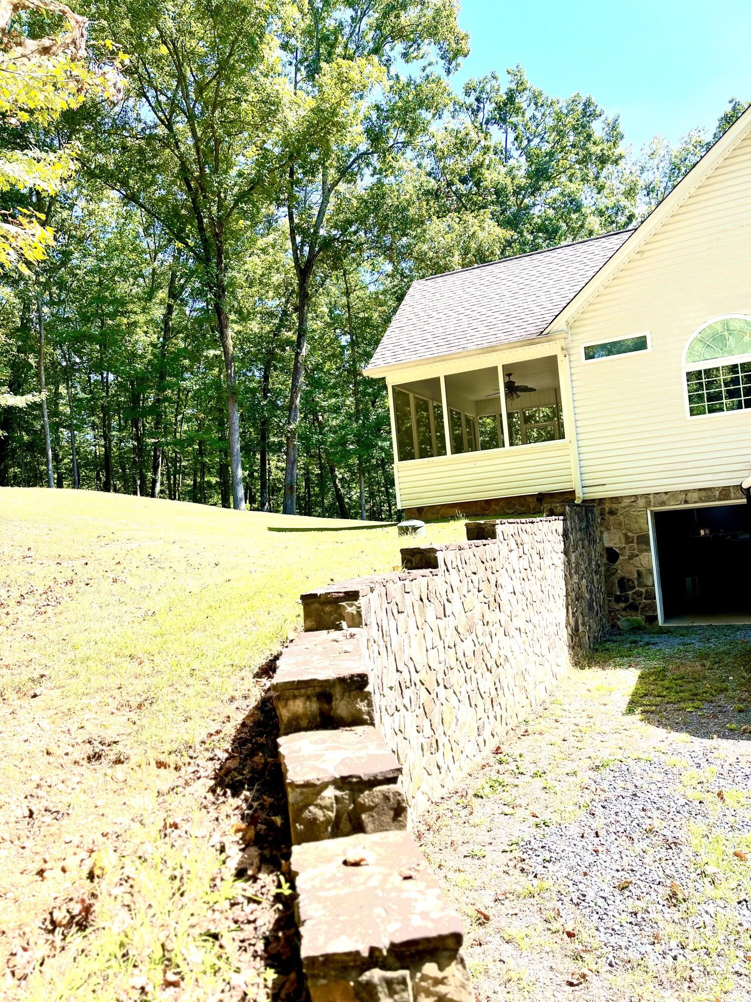 6161 Lamontville Road Decatur, TN 37322 - Photo 4 of 41 a view of a back yard of the house