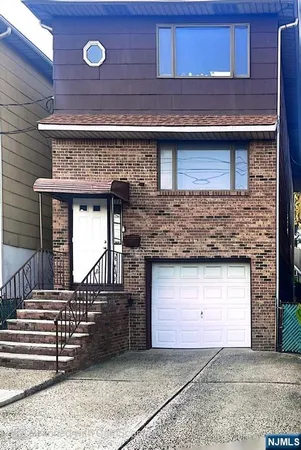 a front view of a house with a garage