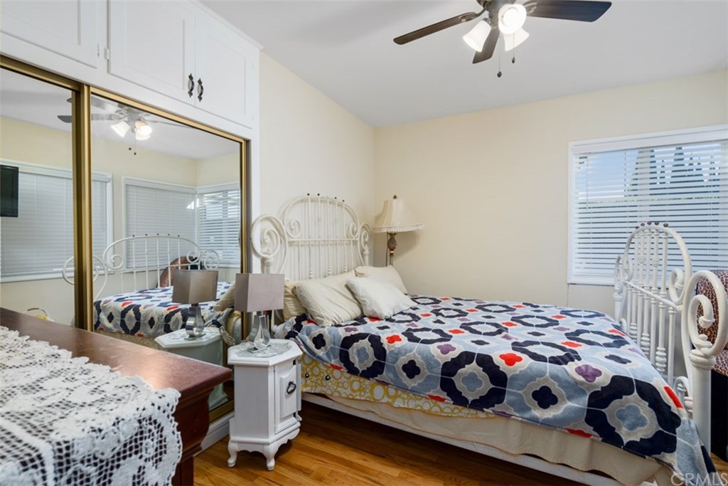 7955 Brookpark Road Downey, CA 90240 - Photo 18 of 27 a bedroom with bed and wooden floor
