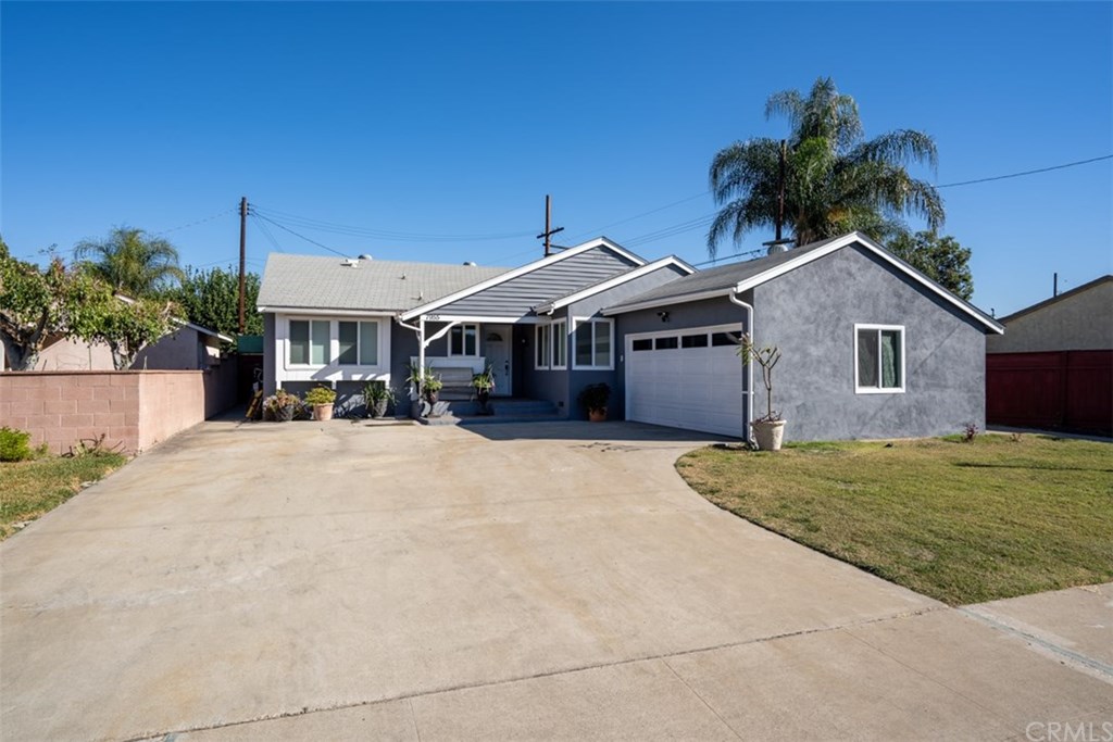 7955 Brookpark Road Downey, CA 90240 - Photo 2 of 27 a front view of a house with a yard