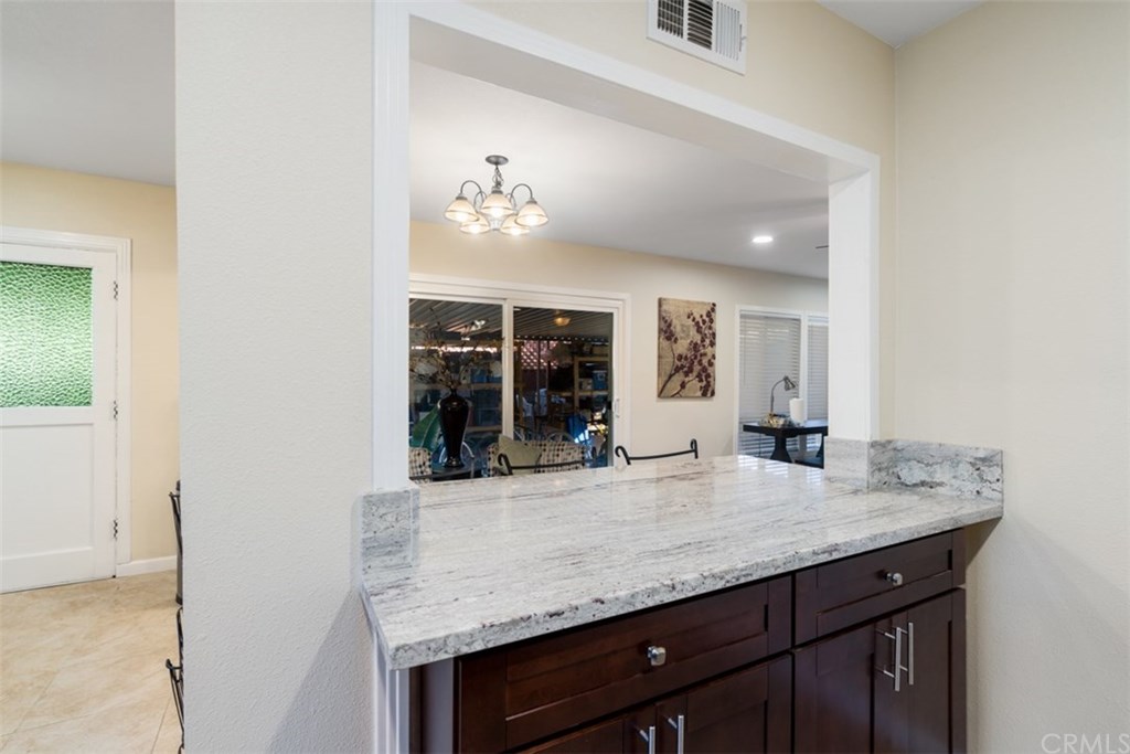 7955 Brookpark Road Downey, CA 90240 - Photo 8 of 27 an outdoor kitchen with granite countertop a sink and cabinets