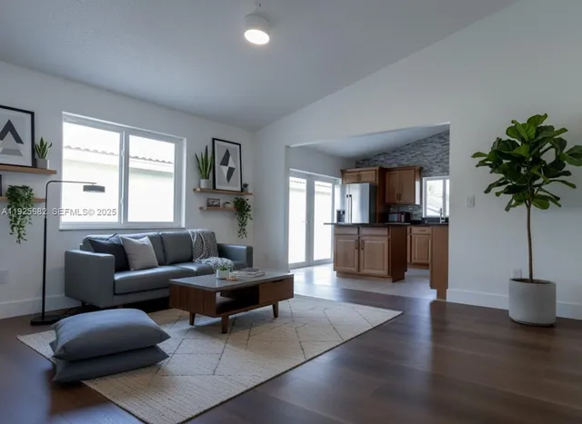 a living room with furniture and a large window