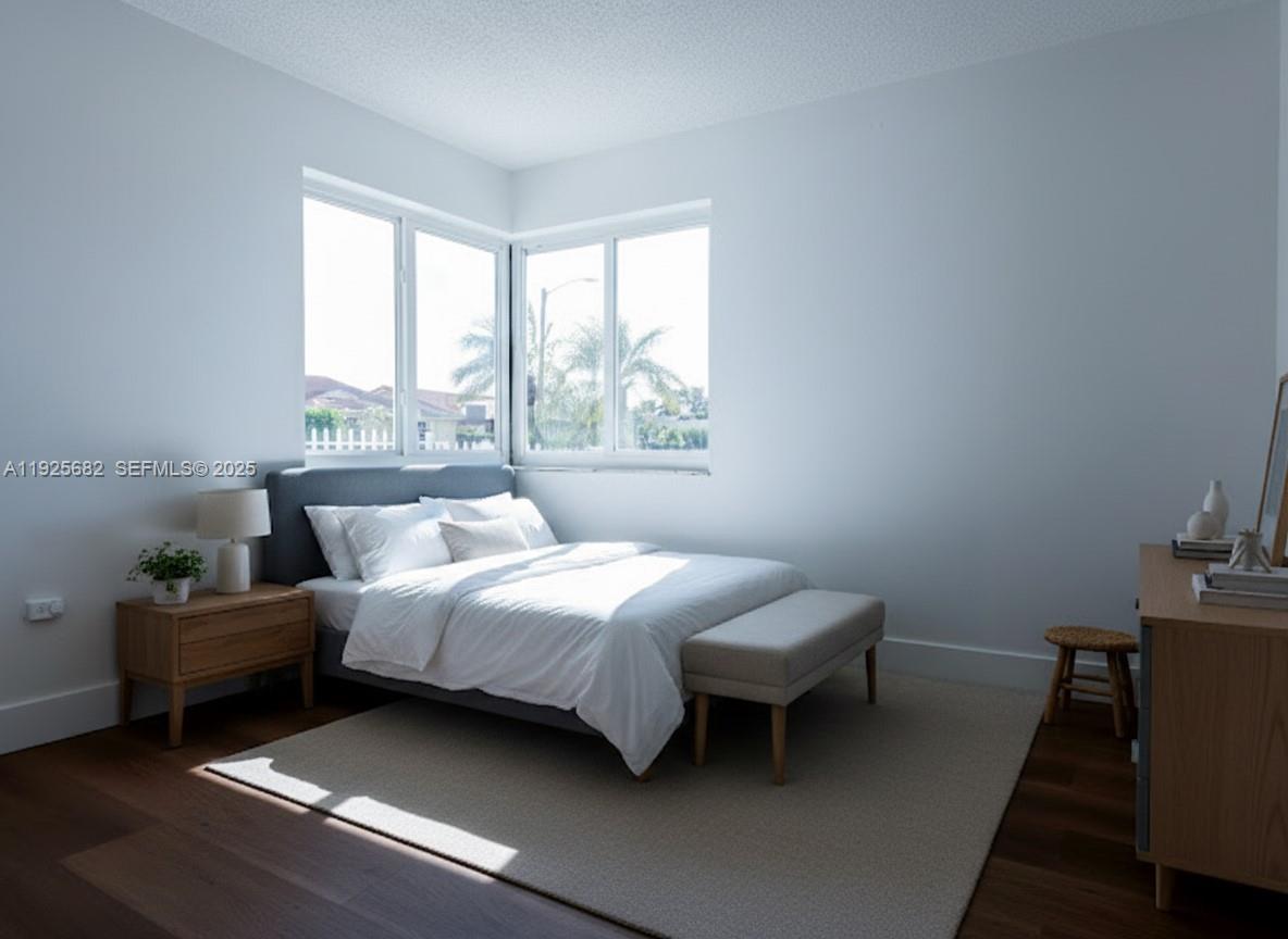 11475 Southwest 181st Street, Unit A Miami, FL 33157 - Photo 2 of 18 a bedroom with a bed and window