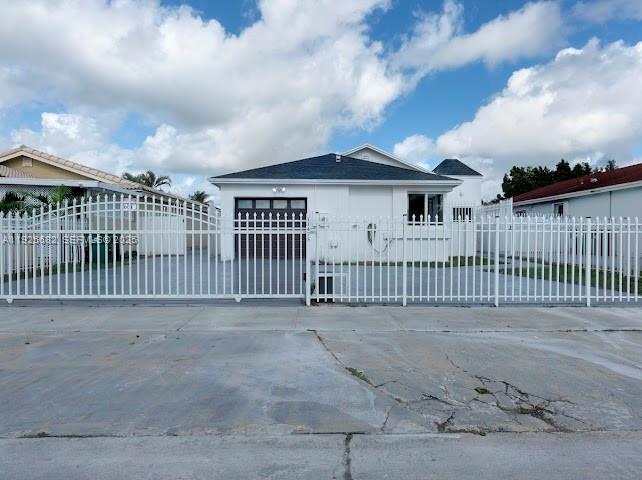 11475 Southwest 181st Street, Unit A Miami, FL 33157 - Photo 5 of 18 a view of a wrought iron fences in front of house