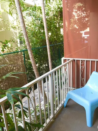 a view of balcony with furniture