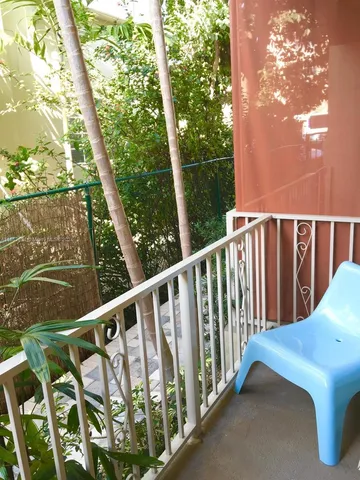 a view of balcony with furniture