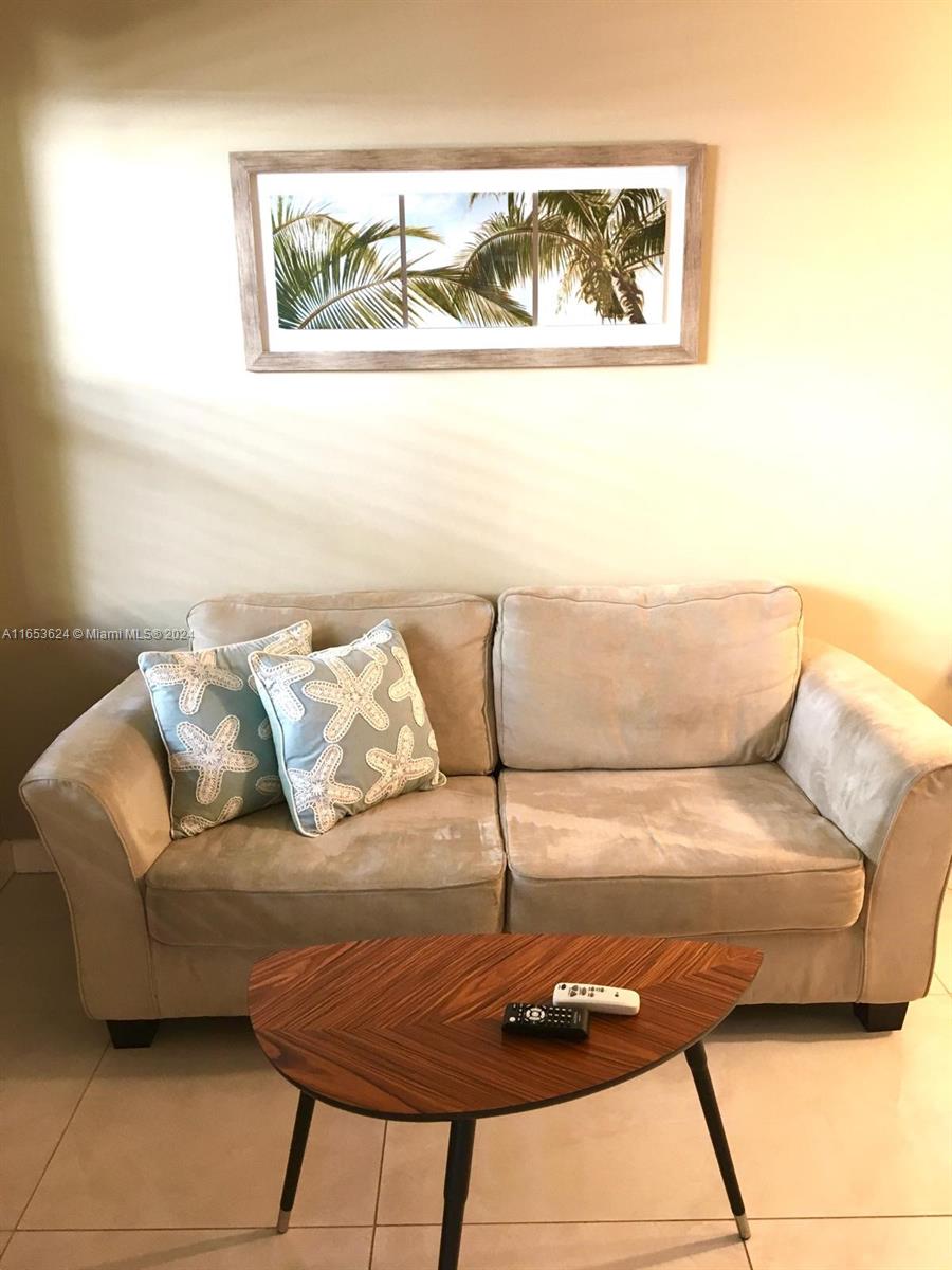 1228 Pennsylvania Avenue, Unit 2 Miami Beach, FL 33139 - Photo 3 of 9 a living room with a couch
