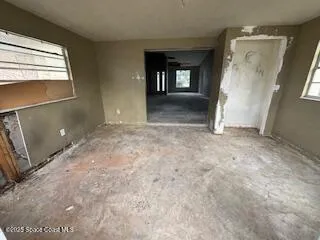 an empty room with windows