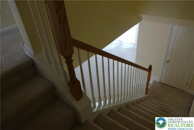 a view of a balcony with wooden floor