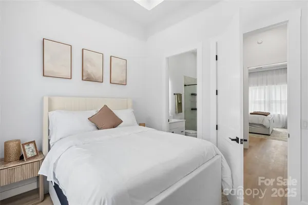 a bedroom with a bed and a mirror