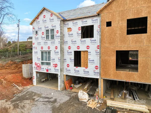 a view of multiple houses with a yard