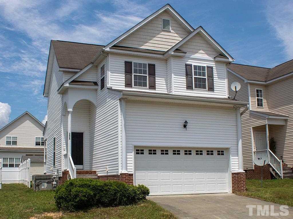3824 Pin Oak Road Raleigh, NC 27604 - Photo 1 of 27 a front view of a house with a yard and garage