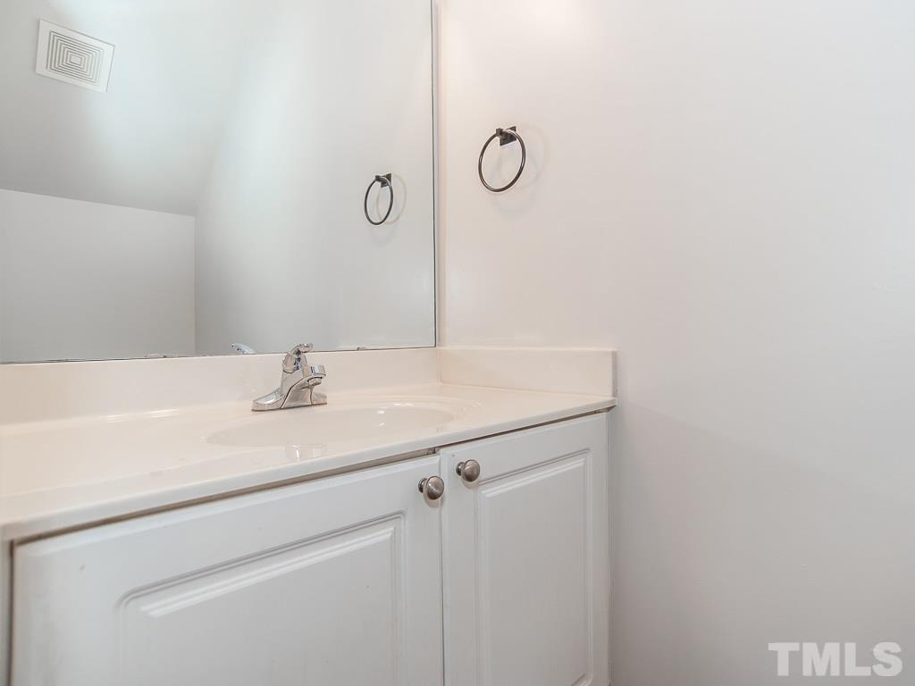 3824 Pin Oak Road Raleigh, NC 27604 - Photo 13 of 27 a bathroom with a sink and vanity