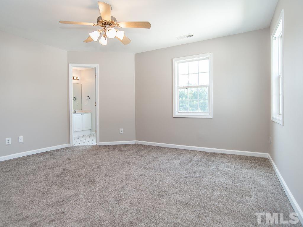 3824 Pin Oak Road Raleigh, NC 27604 - Photo 16 of 27 an empty room with windows and fan