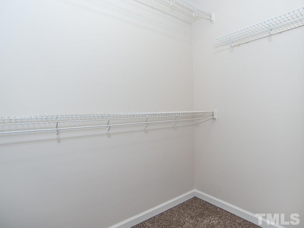 3824 Pin Oak Road Raleigh, NC 27604 - Photo 17 of 27 a view of a room with racks on the wall
